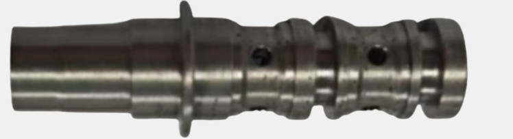 Three-way valve surface: reflective metal and multi-surface geometry require controlled robot access for complete coverage.